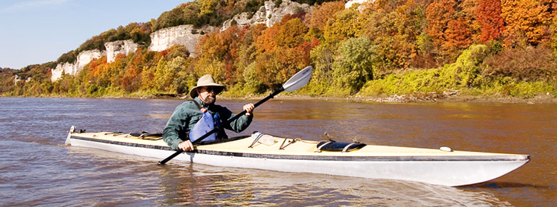 Kayaker paddling in the Fall