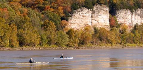 Paddlers below bluffs